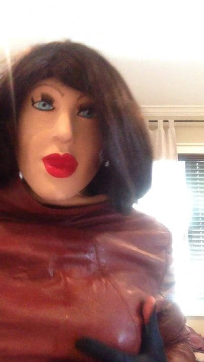 Having fun with female mask and leather coat