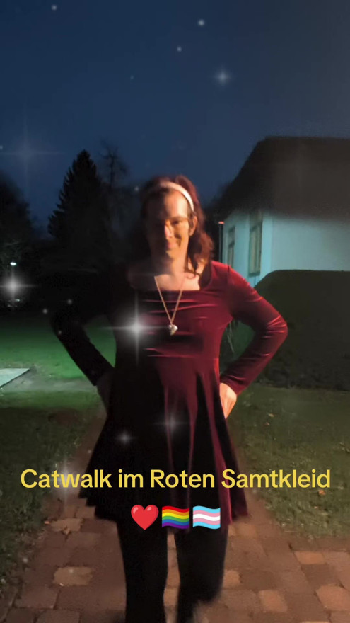 Catwalk in red velvet dress.