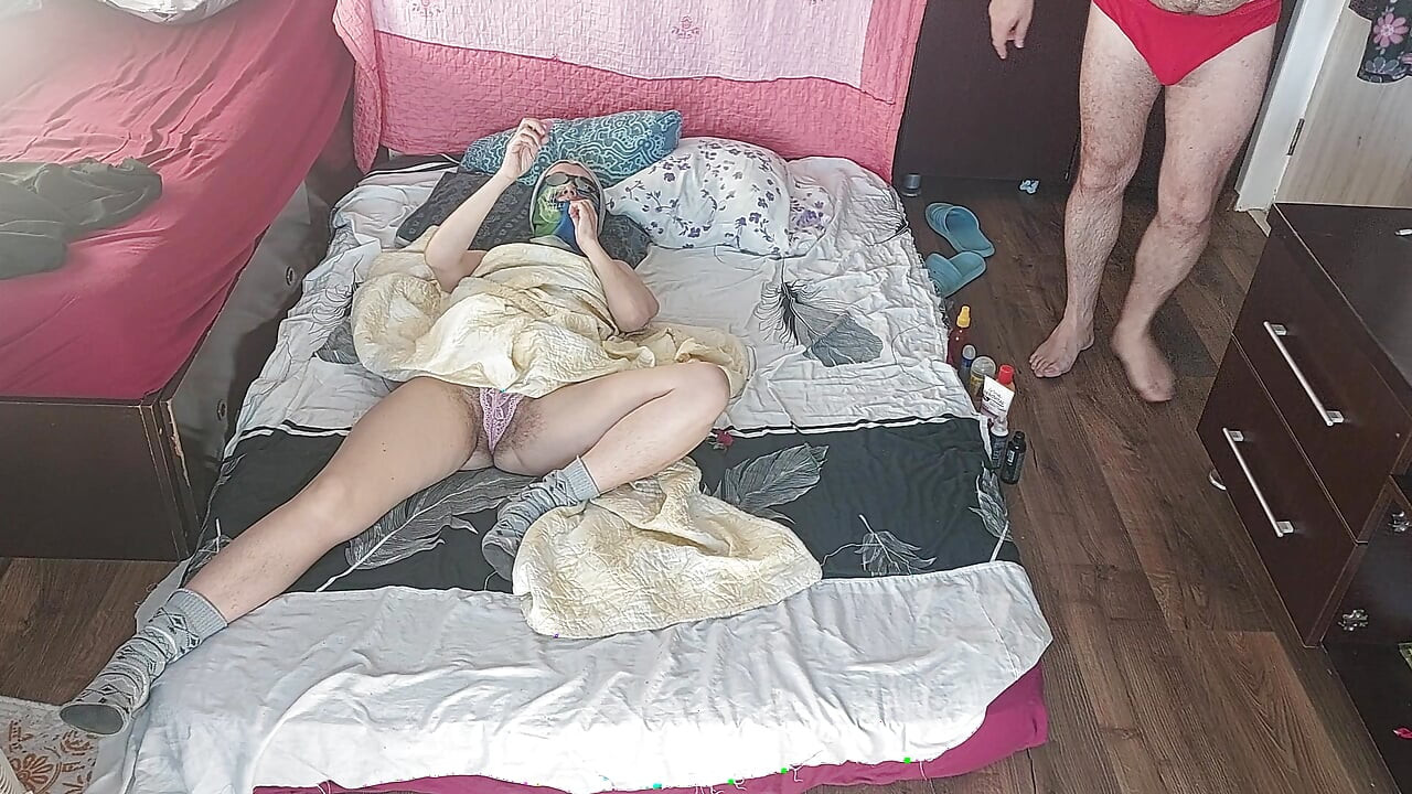 Foreplay in the bedroom with an amateur couple.