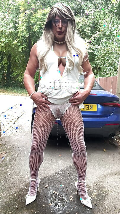 Sexy Crossdresser kellycd2022 in sexy white mini dress and fishnet pantyhose and heels