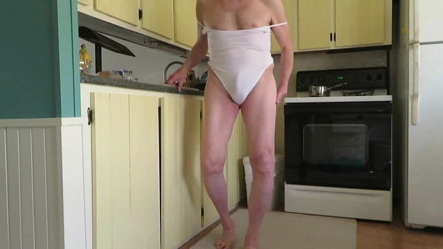 Male slut in a woman's leotard has a fem ass