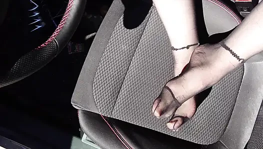 Feet of Nylonjunge in Pantyhose in Car