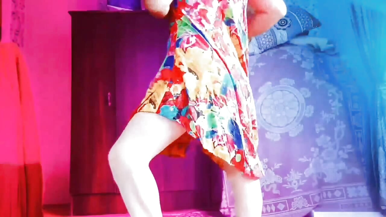 Playful sissy holding pastel gift box with smile