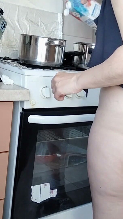 Sexy Latina nude in the kitchen. Sexy naked wife prepares food in the kitchen. | Clip 1