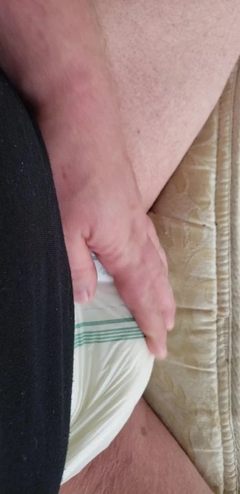 Feeling the diaper bulge.