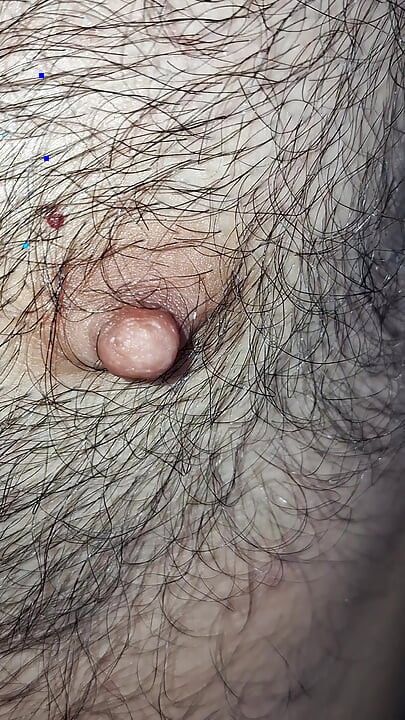 Male nipples in the foreground