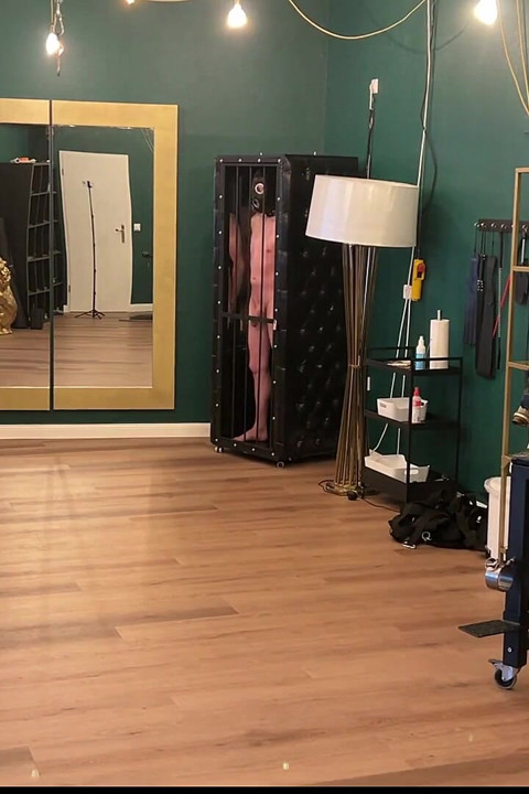 Mature Latex Dominatrix Commands Leashed Naked Slaves