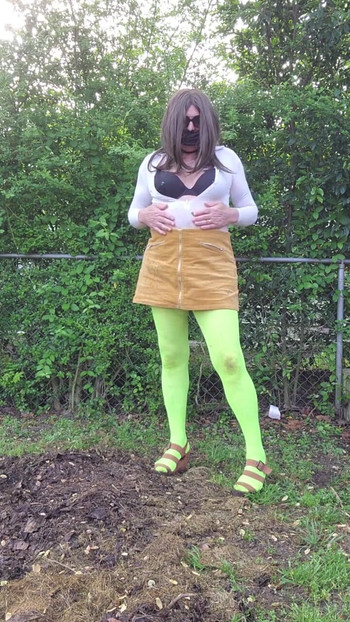 Stunning moment from "Gay crossdress tease, outdoors ground humping in pantyhose, black bra, miniskirt."