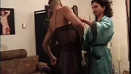 Crossdressing guys bend each other over and fuck in the ass