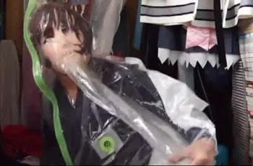 Girl in Mask Seals Herself in Vaccuum Bag