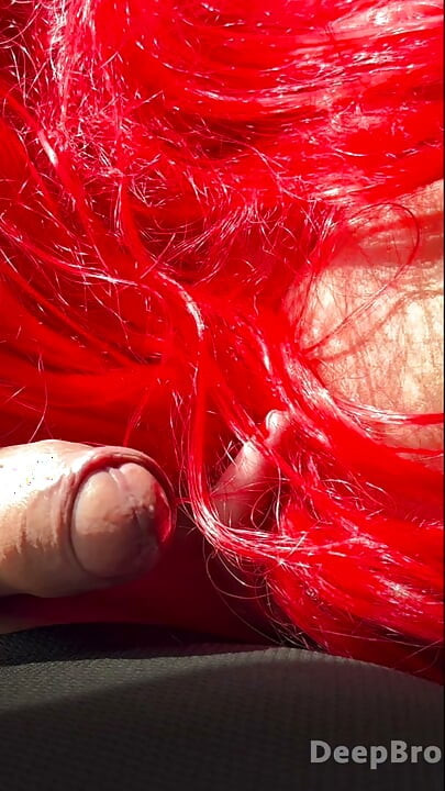 Redhead deepthroats thick BBC in the car, fingers gripping tight
