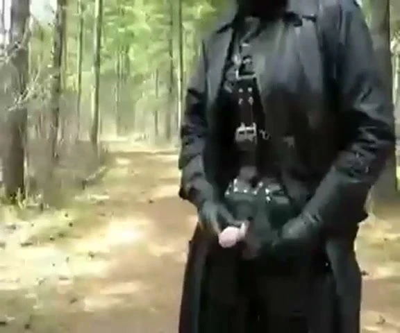 Full leather enclosure wank in public in the woods.