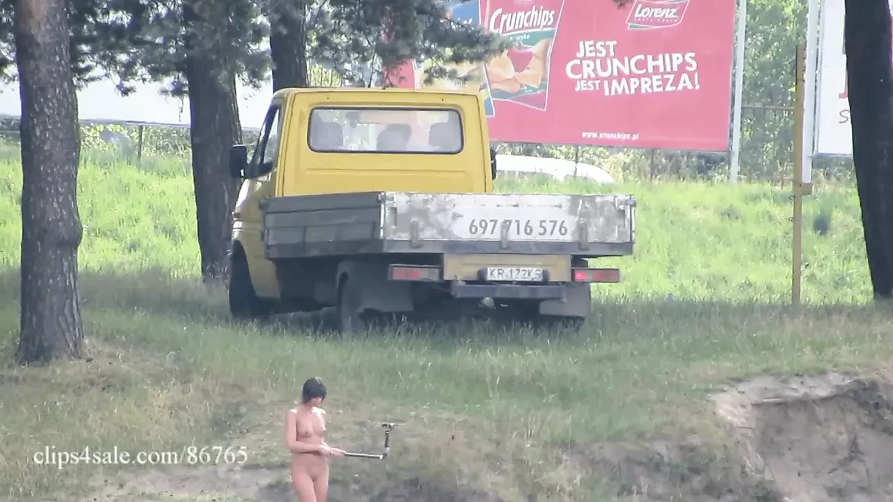 Ola walking alone naked on a public beach (voyeur version)