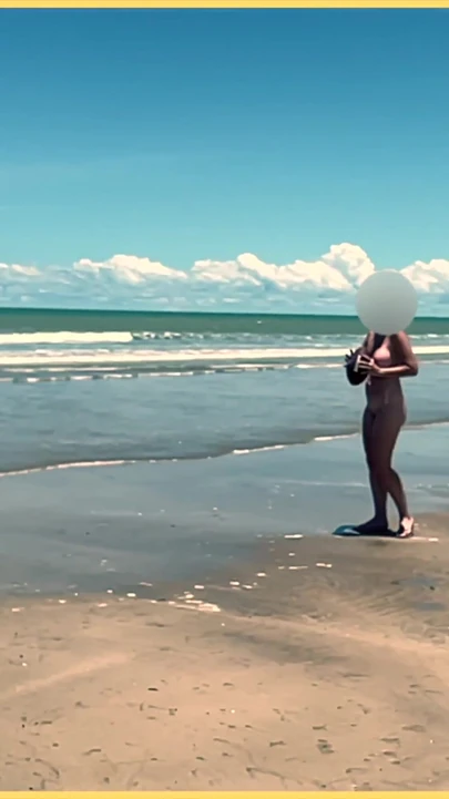 Jaw-dropping moment from "Wifey strips nude and plays with the football at the beach"