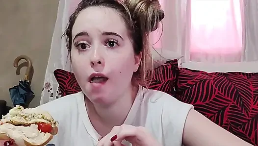 Eating an omelette sandwich with cherry tomatoes