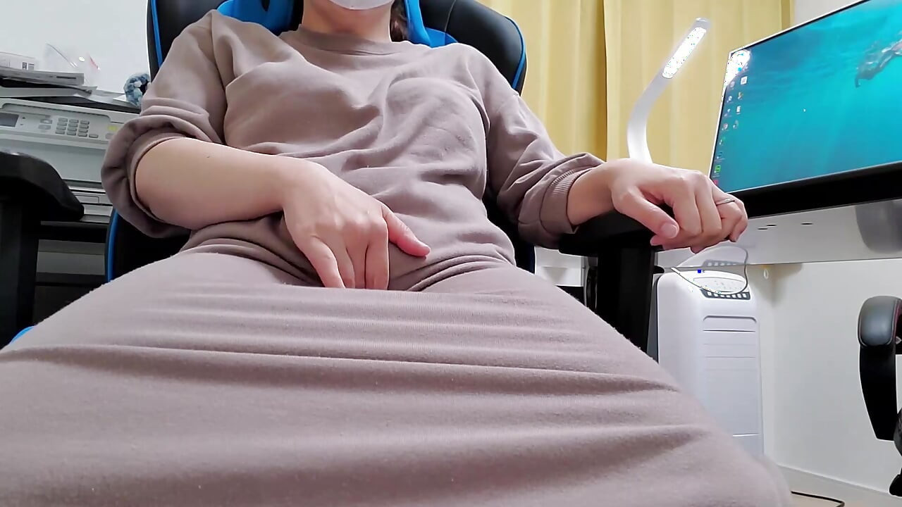 A married woman sitting on a chair and masturbating lewdly