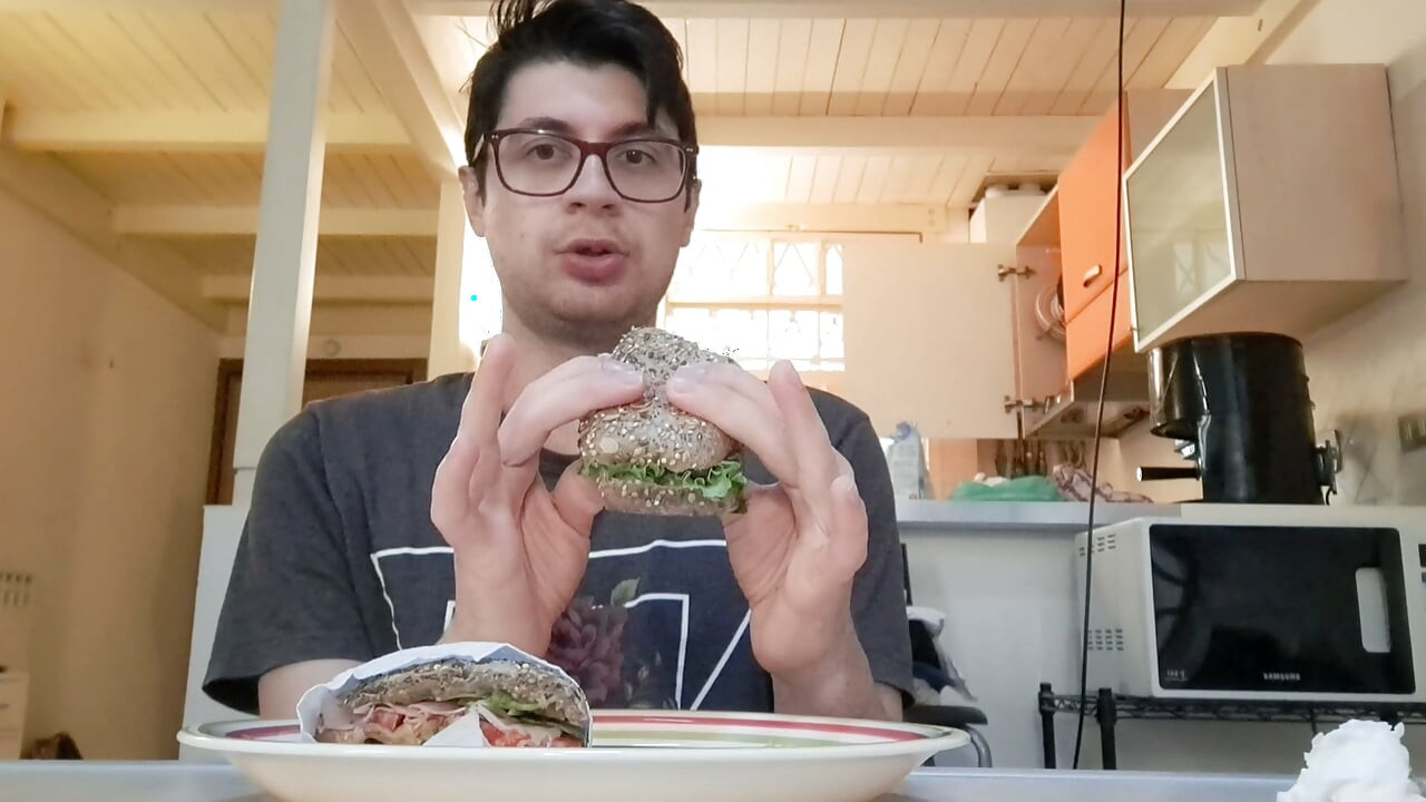 Pig guy eats a sandwich while jerking big cock