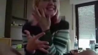 Pink haired girl jerks off a big cock