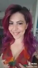 Sexy chick squeezing her tits