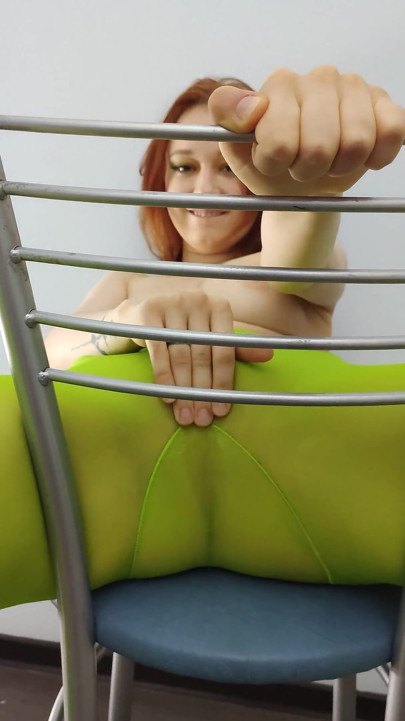 Redhead Teen Feeling Horny in Green Tights on Chair