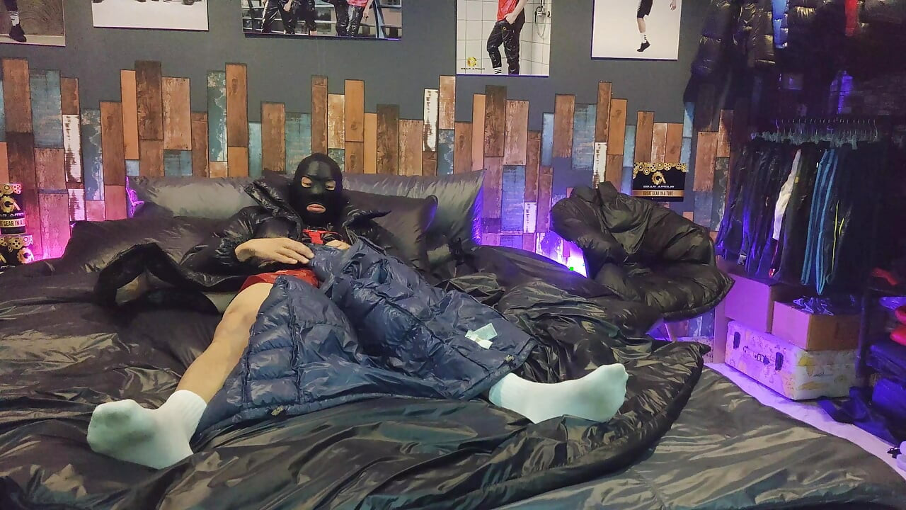 Cock Rubbing Down Jacket on Shiny Nylon Bed