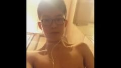 Asian boy with glasses masturbates and cum