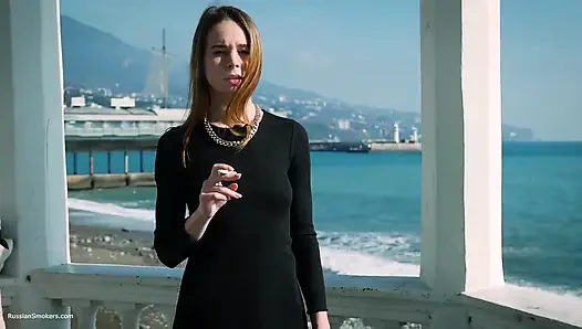 Young Russian Girl Smoking Cigarette by Seaside