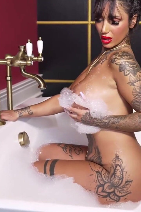 Busty Tattooed MILF Tyra Soaks in Her Wet Dreams