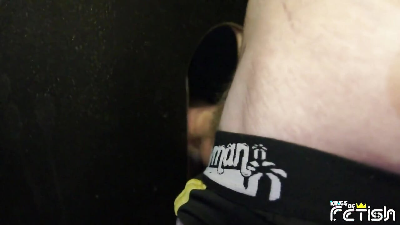 Tattooed man fucks a twink guy with tight ass after getting his big cock sucked trough gloryhole