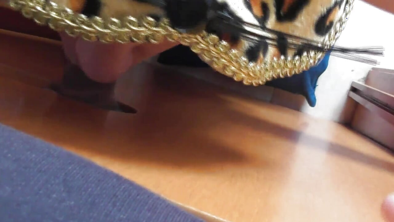 Having a blowjob through a hole, I don't know who it is.