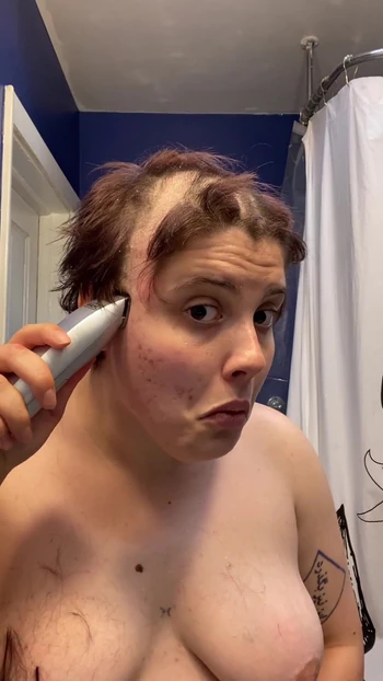 Iconic moment from "Hairless Whore - Adama Daat Amateur Fetish Head and Brow Shave"