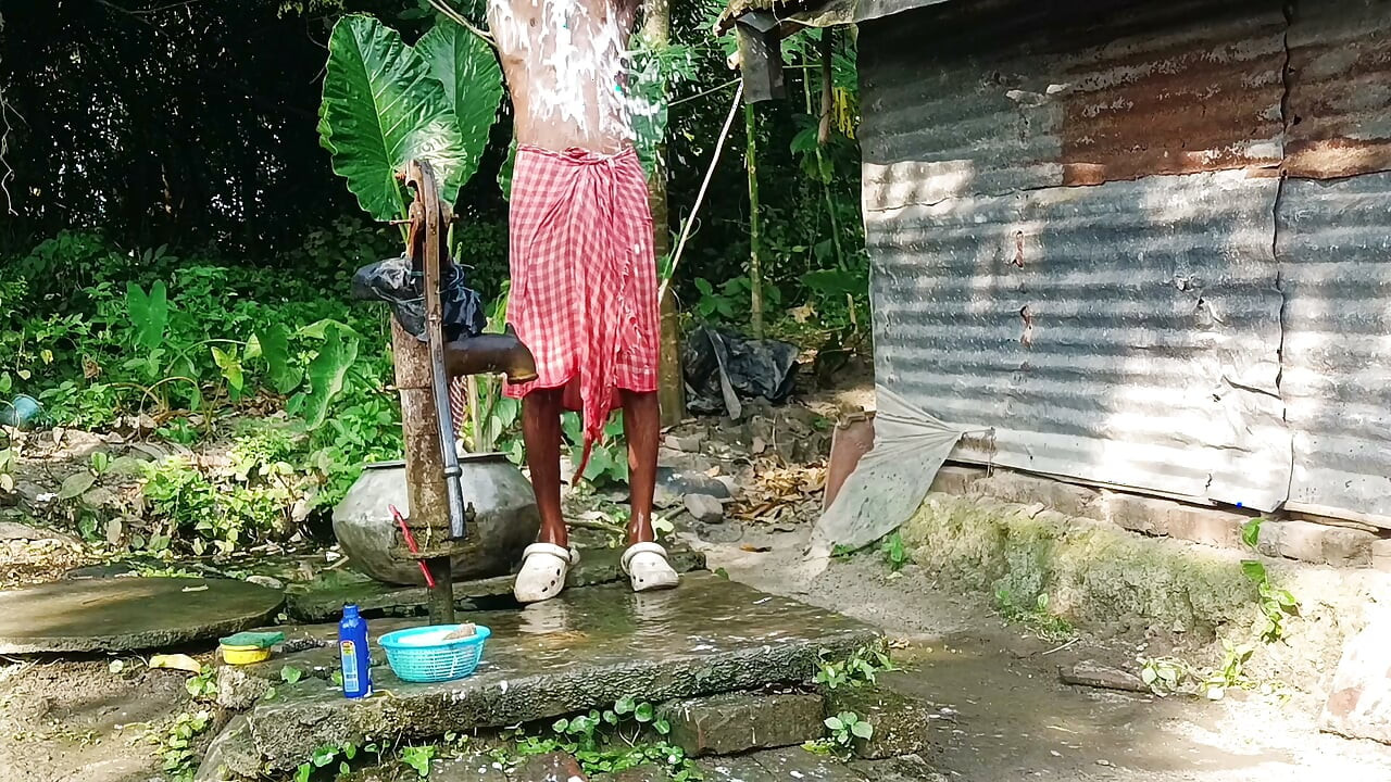 Desi young man bath Open place.