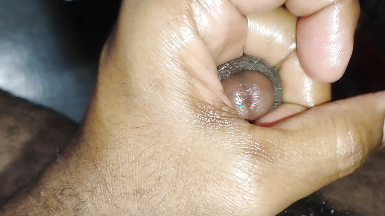 Massage of penis with Ayurvedic oil