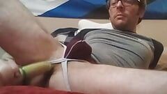 PupFritz plays with a wrapped sex toy in bedroom