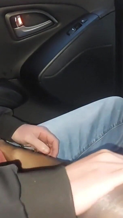 Mature stepmom gives her stepson a nylon footjob in the car in public | Clip 1