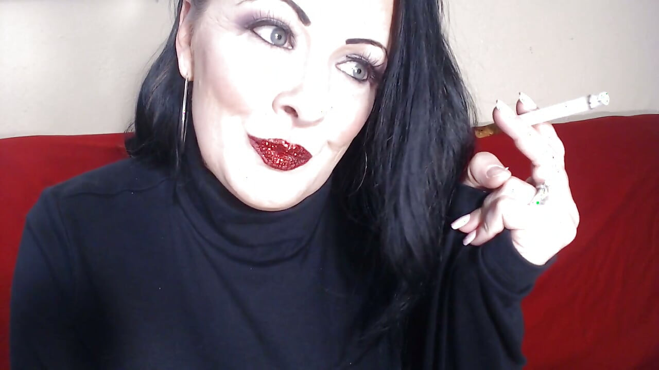 Closeup smoking red glittered lipstick
