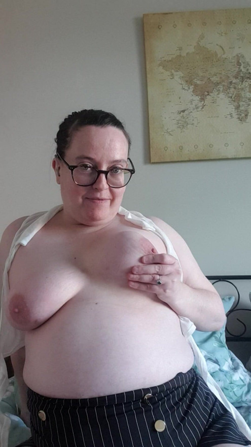 Sexy Secretary playing with her big breasts