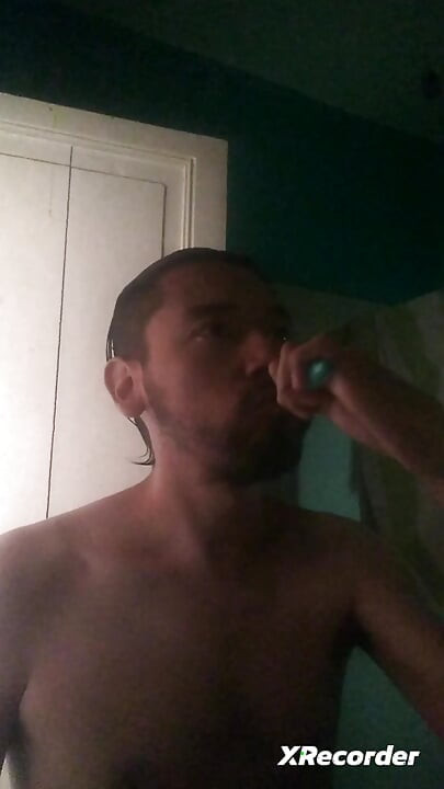 Man does his skincare in the morning