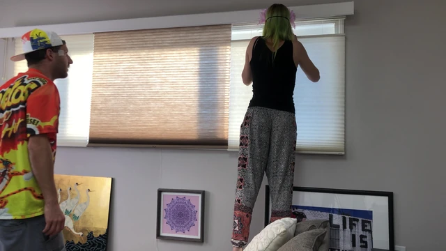 Couple Peeping Outside Apartment Window
