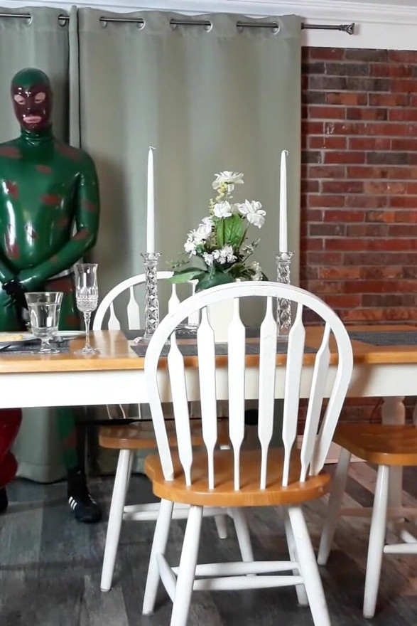 Ass whipping in a full body latex suit
