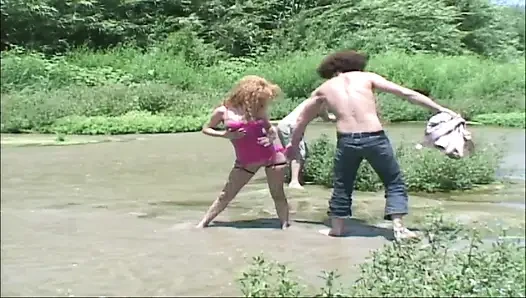 Two big cocks penetrate a milf's pussy and anus into the lake