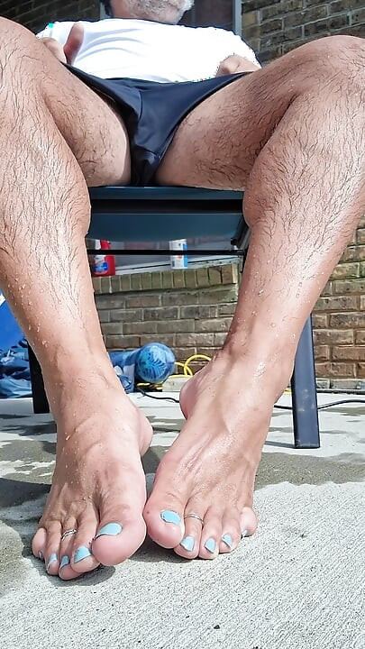 Posing my wet legs and feet by the pool before I jerk off and cum