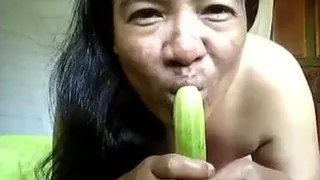 Thai gf topless cucumber blowjob