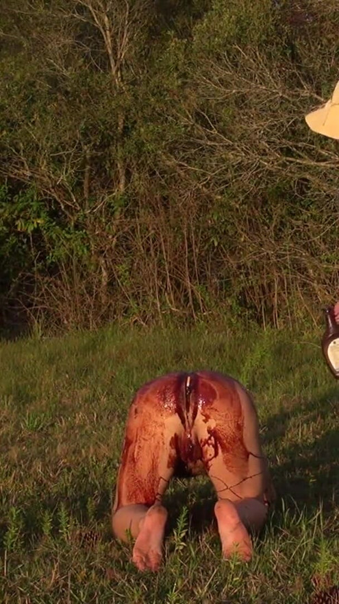 sex slave bathes in chocolate in the field! | Clip 1
