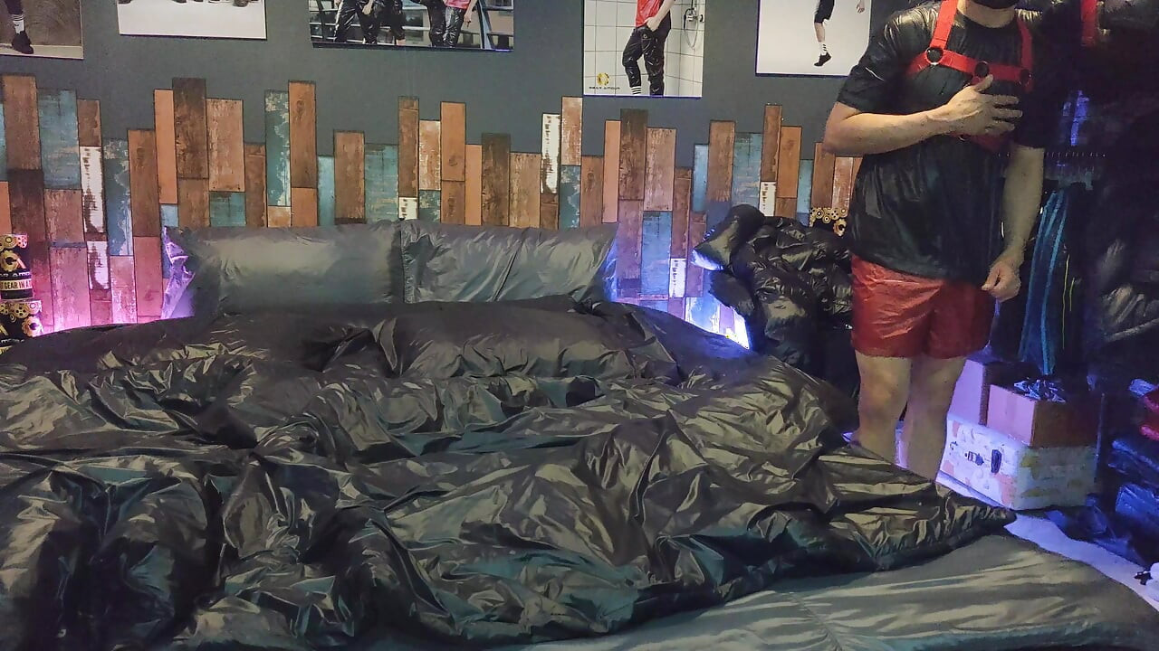 Cock Rubbing Down Jacket on Shiny Nylon Bed