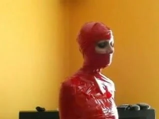 Mummified Bondage Babe In Red Tape