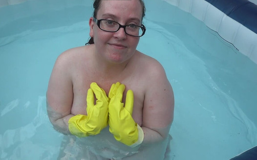 Naked rubber gloves fetish in the hot tub