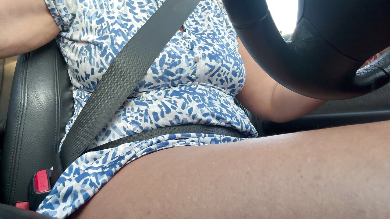 Elegant stepmom is in a good mood on her way to work and is approached by a curious driver