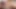 Brunette Asian shemale in red dress jerks off and cums on