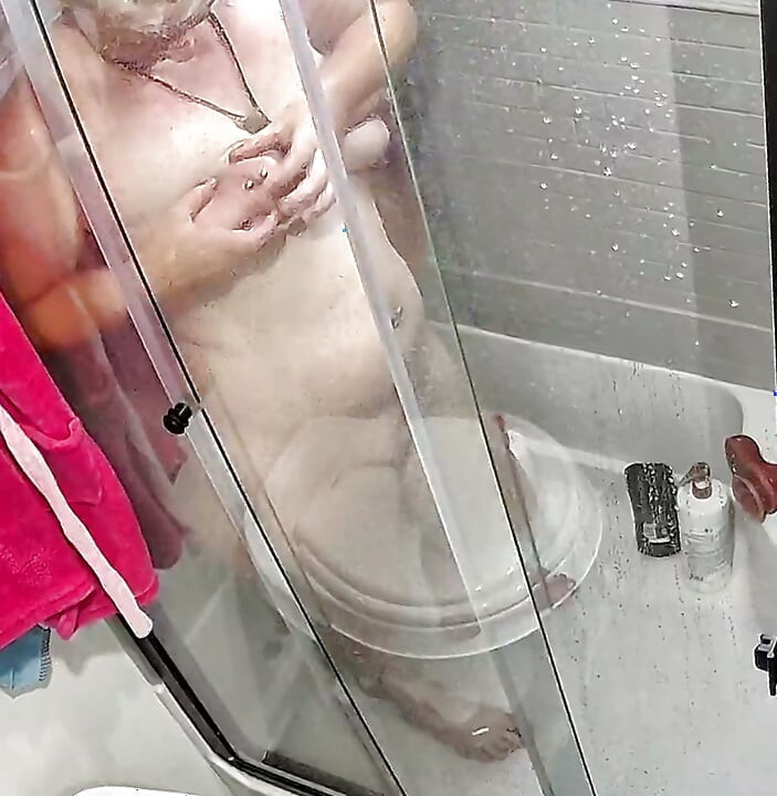 I was hot, wet, and horny in the shower and just had to fuck both my holes.